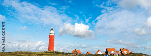 Red lighthouse and houses in texel