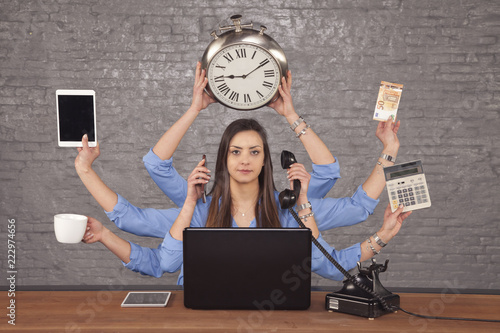 multitask businesswoman sat at the desk in the office, concept of well organized work