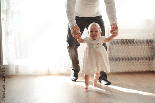 Father and his daughter child girl first step