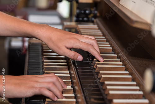 Person plays organ - close-up