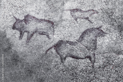 An image of ancient animals on a cave wall painted by an ancient man. history of antiquities, archeology.