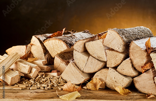 Stack of wood logs sitting on top of table