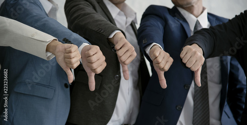 group businesspeople thumbs down together. concept rejection and boycott.