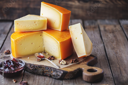 fresh cheese on wooden cutting board