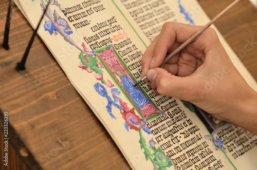 Close-up of hand of medieval manuscript scribe - calligraphy