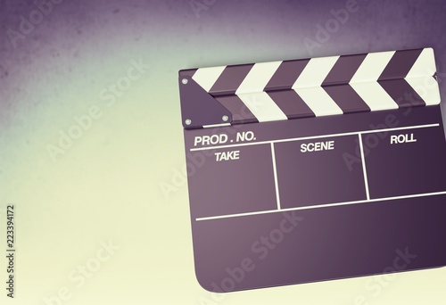 Movie clapper board on background