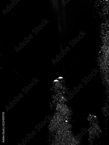 Solid Black Background with White Bubbles Rising