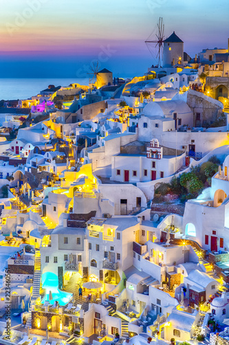 Travel Concepts. Skyline of Oia Town with Traditional White Architecture and Iconic Windmills in Village of Santorini in Greece.World Famous Resort.