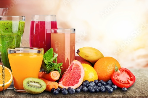 Composition of fruits and glasses of juice