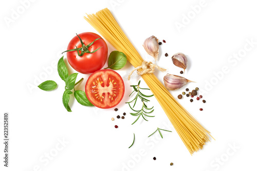 Spaghetti with tomatoes garlic and basil isolated on white background. Top view.