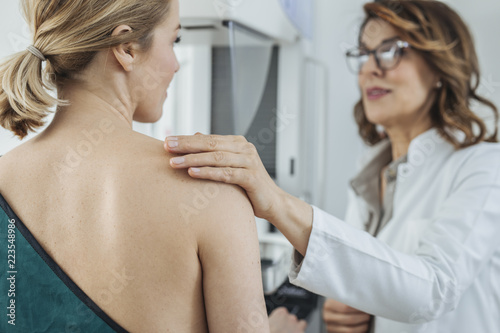 Woman Physician Talking With Her Patient