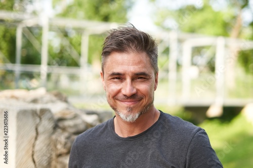 Outdoor portrait of happy older white man