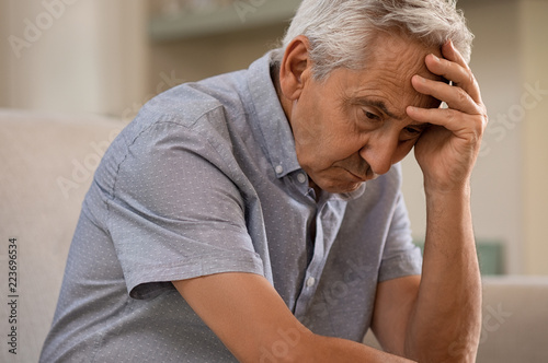 Depressed senior man at home