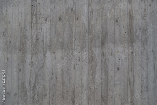 Concrete gray wall with wood plank texture.