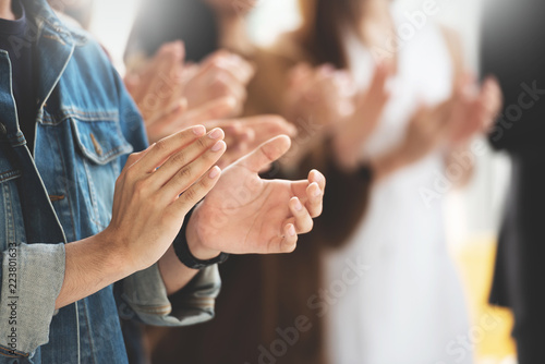 Cropped image of Creative designers audience applauding at a business seminar.