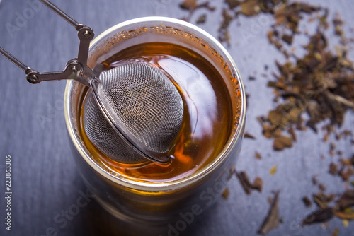 Double walled glass with tea and stainless steel tea infuser