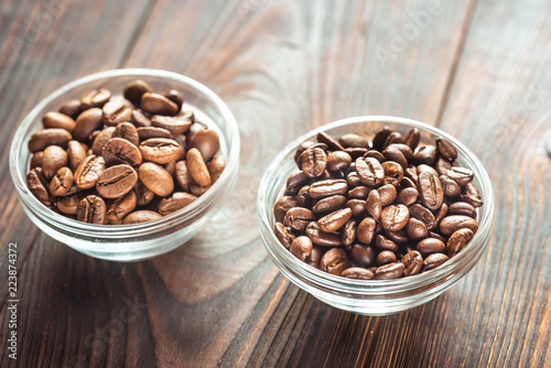 Bowls of arabica and robusta coffee beans