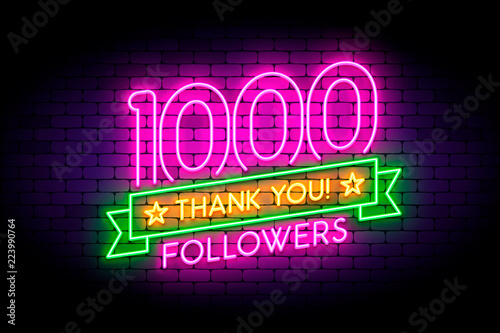 1000 followers neon sign on the wall.