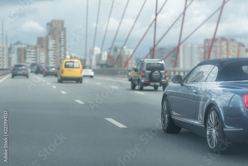 Car driving on freeway at the bridge
