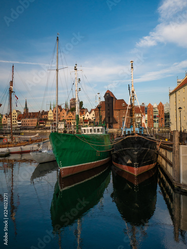 Ships on Motlawa river in Gdansk, Poland and oldest medieval port crane 