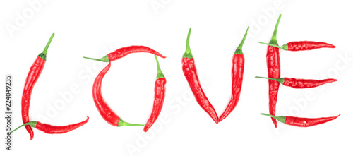 Word love written from red hot pepper letters isolated on white background