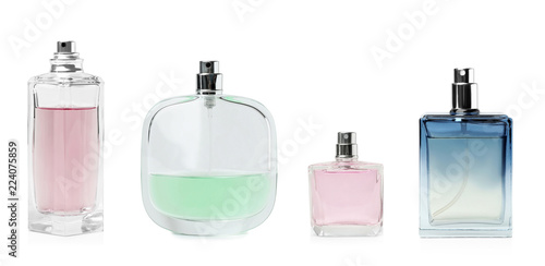 Set with different blank perfume bottles on white background