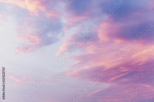 Pink clouds on blue sunset sky