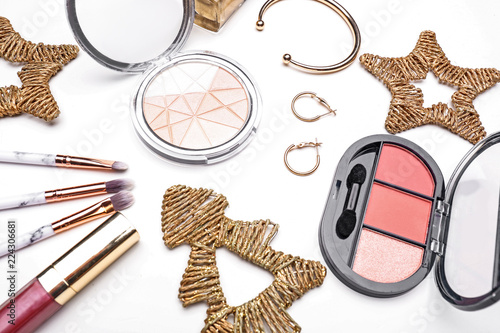 Set of cosmetics with Christmas decorations on white background