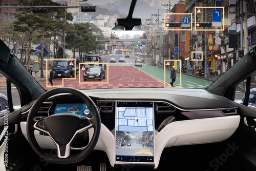 Autonomous car with HUD (Head Up Display). Self-driving vehicle on city street