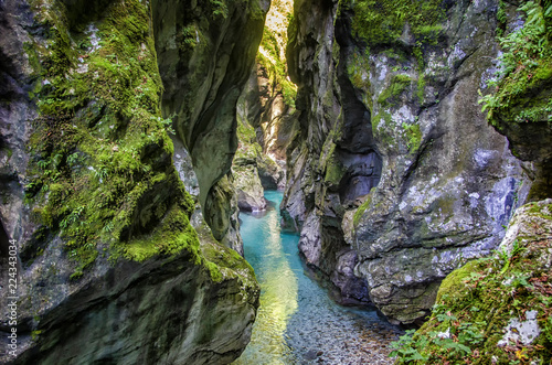 Crystal clear emerald mountain river