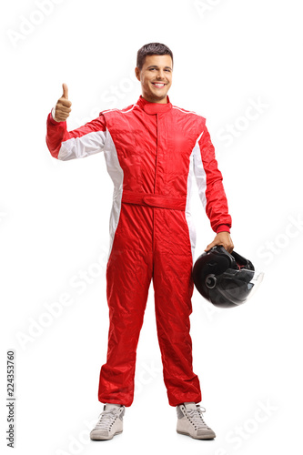 Car racer in a suit showing thumbs up
