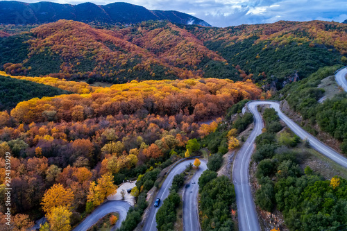 Aerial view of the the Vikos Gorge in the autumn and provincial road with many zigzag in the Epirus Zagorohoria, Greece. National park