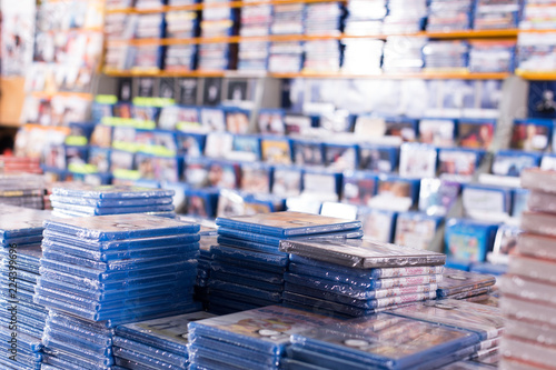 CDs and DVDs on piles at store