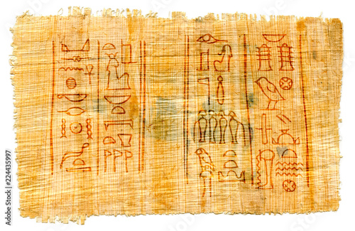 Ancient papyrus with Egyptian hieroglyphs: the names of Isis, the great goddess (at the left) and her husband Osiris, the god of the Underworld (at the right). The Karnak Temple, Thebes Valley, Luxor.