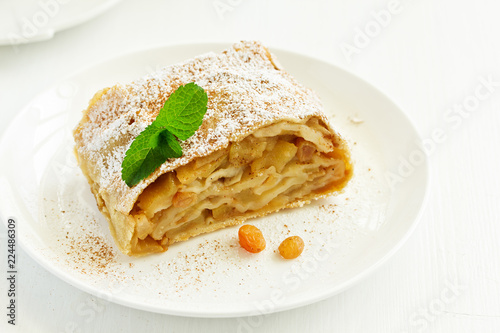 apple strudel with cinnamon and an ice cream ball.