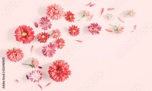 Flowers composition. Pattern made of fall flowers on light pastel pink background. Autumn concept. Flat lay, top view 