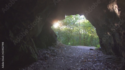 view of the exit of the cave with sunlight
