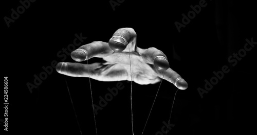 Eerie puppeteer hands controlling you. Manipulation concept