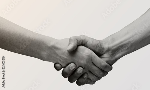 Business agreement handshake on white background. Black and