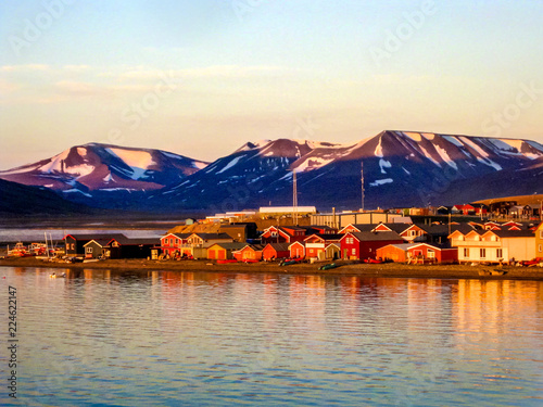 Midnight sun on the Longyearbyen waterfront in Svalbard in the Norwegian arctic