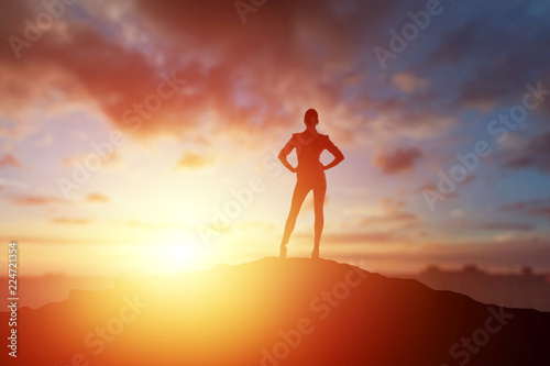Creative background, business silhouette, business girl on the background of a beautiful, golden sunset. The concept of inspiration, enthusiasm, start-up, feminism symphony.