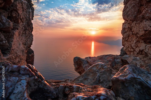 Fortress wall on mountain view of sunset on sea