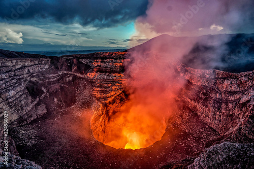 Masaya Volcano crater with burning lava and smoke