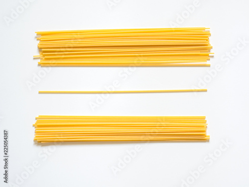Dry spaghetti on a white background for the menu. Geometric background. Flat lay, copy space, top view