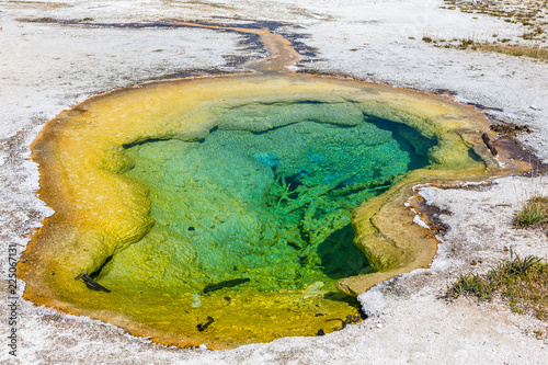 Deep hot spring with turquoise water and yellow edges, Yellowstone National Park, USA