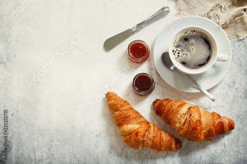 cup of coffee and croissants, top view