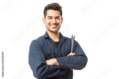 Mechanic With Wrench Standing Hands Folded On White Background