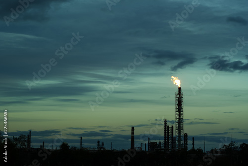 night silhouette industrial landscape - flares for flaring associated gas in an oil field..