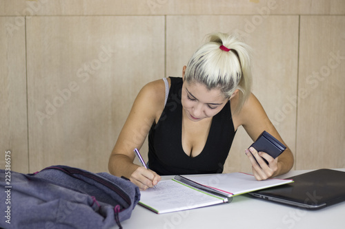 pretty young student girl with calculator