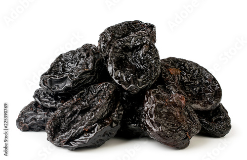 A bunch of dried plums closeup on a white. Isolated